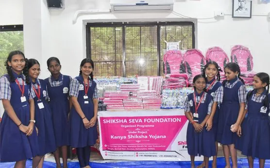 Girls in school uniform with Kanya Shiksha Yojana school bags and stationery kits